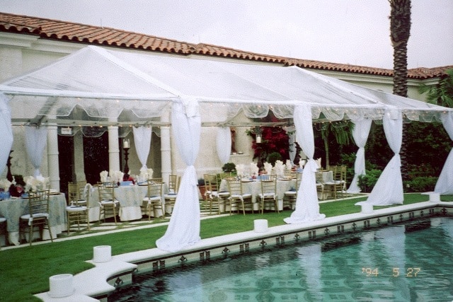Poolside tented wedding reception setup by Creative Events