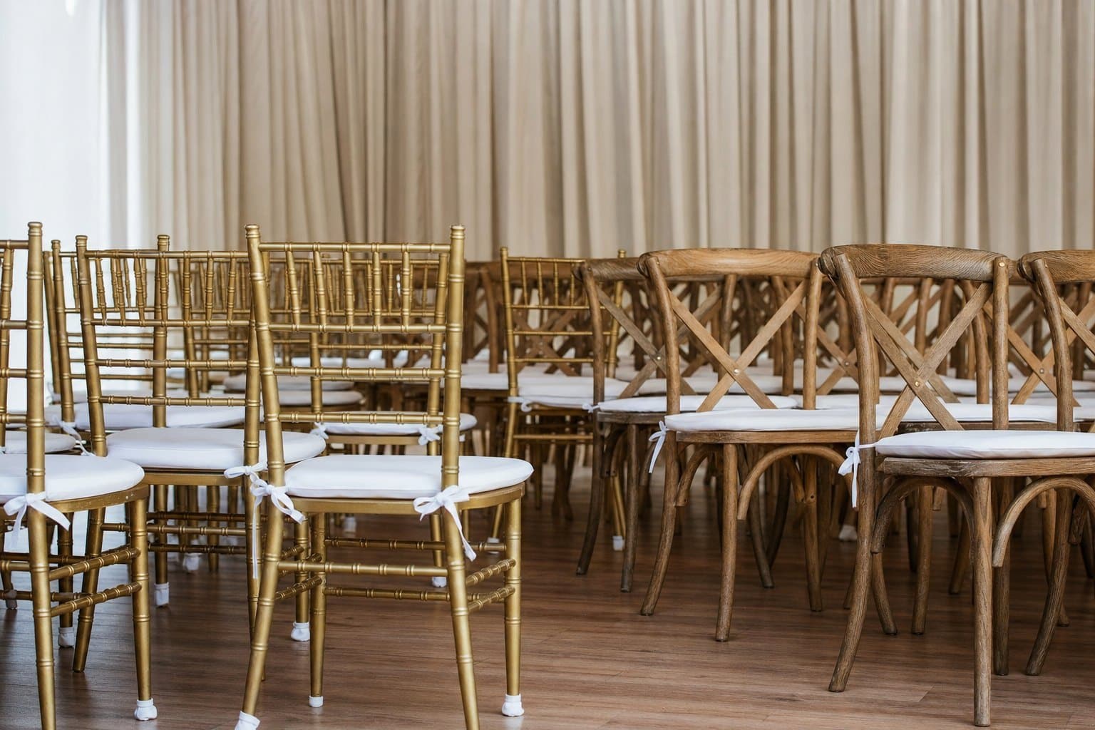 Gold chiavari and natural cross-back specialty event chairs from Creative Events & Rentals