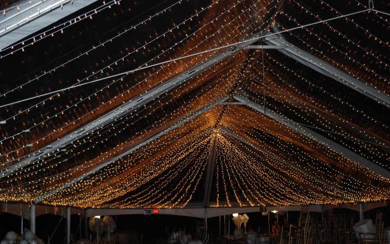 Dramatic tent ceiling lighting for an evening event