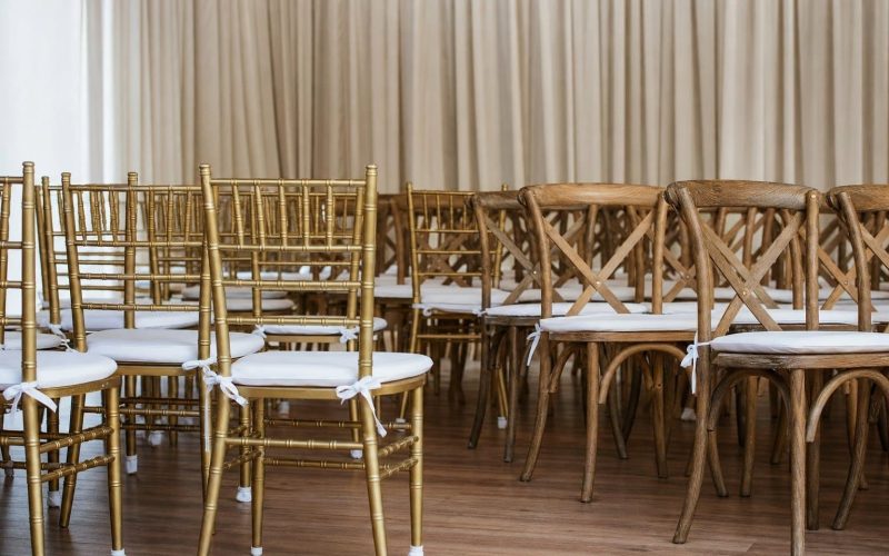 Gold chiavari and natural cross-back specialty event chairs from Creative Events & Rentals