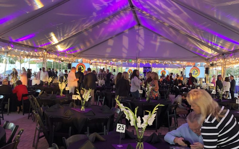 Gala event with purple uplighting by Creative Events & Rentals