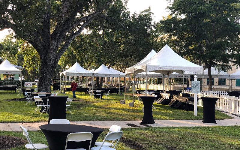 Tables and chairs at a park event by Creative Events & Rentals